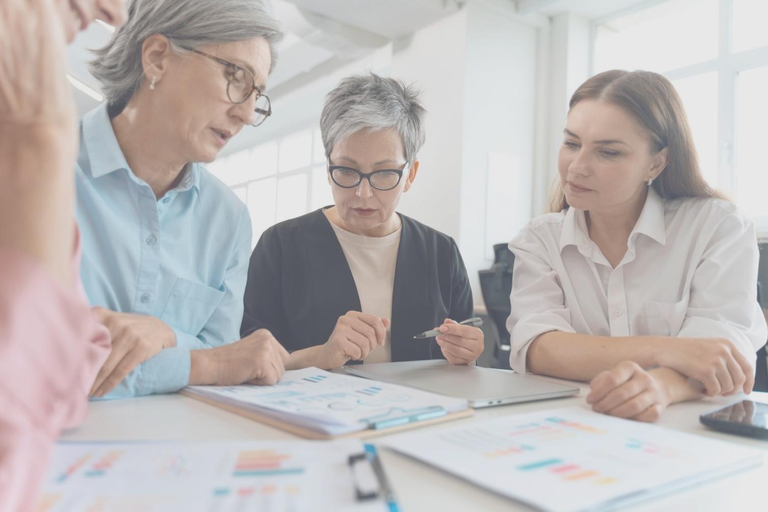 Students analyzing financial data and charts during an interactive learning session